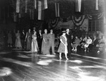Men and Women Walk Across a Gymnasium Stage at a Pan American League Event by Robertson and Fresh