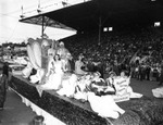 The Memphis Cotton Carnival Float with a Stadium of Spectators