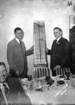 Receiving Golf Clubs During a Banquet by Robertson and Fresh (Firm)