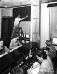 A Worker Closes Blackout Curtains at the Peninsular Telephone Company