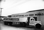 Security Feeds Truck Parked in Front of Tip-top Auto Painting and Body by Robertson and Fresh