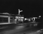 The Tampa Bay Liquor Store on MacDill Avenue All Lit Up at Night by Robertson and Fresh (Firm)