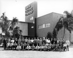 Tampa Electric Company Employees Pose for a Picture Outside the Company