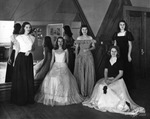 Women Students Dressed in Evening Gowns Pose for a Picture