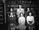 Women Student Leaders and an Educator Pose in the Library at the University of Tampa