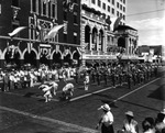 [A Band Marches Past the Elks Club During a Parade] by Robertson and Fresh