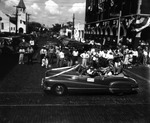 [A Convertible Passes the Elks Club During a Gasparilla Parade] by Robertson and Fresh
