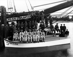 A Harbor Patrol, Group Number Seven Parked next to the Jose Gaspar