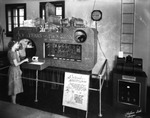 A Woman Making a Call on the Audichron at the Peninsular Telephone Company
