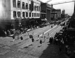 [A Brandon High School Band Marches down Franklin Street During a Gasparilla Parade] by Robertson and Fresh