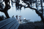 Six People Stand on Shore of Lake Thonotosassa at Shangri-La by University of South Florida