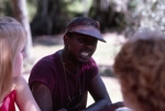 Man Chats with Two Others Outdoors at Shangri-La Retreat by University of South Florida