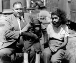 Percilla Bejano with Joe Pearl and a Chimpanzee by Unknown