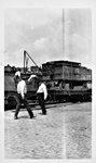 Unloading Railroad Cars, C by Unknown