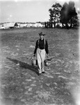 A  Union soldier carrying buckets from his encampment