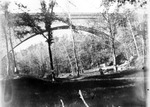 Arched bridge across a wooded valley in Virginia by Archibald Clarke Slaymaker