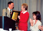 President Betty Castor receiving plaque from Tampa Mayor Dick Greco by University of South Florida