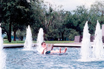 Student relaxing in a fountain