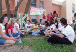Students gathered outside Greek Village housing by University of South Florida