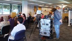 Audience at Faculty Research Lightning Talks, April 23, 2015, D by University of South Florida St. Petersburg. Nelson Poynter Memorial Library