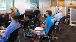 Audience at Faculty Research Lightning Talks, April 23, 2015, O by University of South Florida St. Petersburg. Nelson Poynter Memorial Library