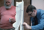 Two men examining Picasso mock-up