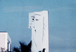 Picasso sculpture mock-up against blue sky next to building