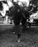 Beulah standing in yard, hand on hip