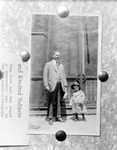 Bulletin board photo of photo of man with little boy in cowboy outfit, part of page of text about photography