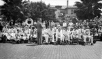Children before playing music in a band, adults standing behind them; Yacht Club in background by Francis G. Wagner and Nelson Poynter Memorial Library