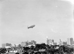 Goodyear Blimp flying over downtown St. Petersburg, including the Times building, Central National Bank and Trust Co., and other tall buildings by Francis G. Wagner and Nelson Poynter Memorial Library