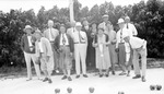 Group of lawn bowlers, men and women posed with balls and trophy by Francis G. Wagner and Nelson Poynter Memorial Library