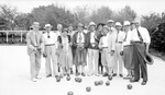 Group of lawn bowlers, men and women posed with balls and trophy by Francis G. Wagner and Nelson Poynter Memorial Library