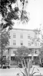 Hotel Deermont, front view with parked cars and trees by Francis G. Wagner and Nelson Poynter Memorial Library