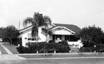 House with striped awnings at 871 17th Avenue North including part of driveway to west by Francis G. Wagner and Nelson Poynter Memorial Library