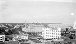 Ponce de Leon Hotel and Soreno Hotel looking north, including waterfront, Yacht Club, house rooftops and buildings one block to west, horse and carriage, cars by Francis G. Wagner and Nelson Poynter Memorial Library