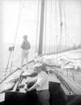 Men on a sailboat, fishing from boat by Francis G. Wagner and Nelson Poynter Memorial Library