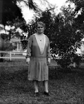 Mattie's caretaker standing in yard, trees and split rail fence in background by Francis G. Wagner and Nelson Poynter Memorial Library
