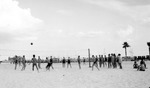 Volleyball players at Spa Beach with cars and Million Dollar Pier in background by Francis G. Wagner and Nelson Poynter Memorial Library