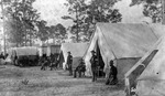 Tents and wagons at military encampment
